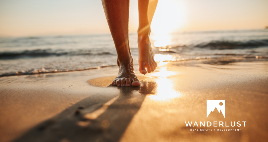 feet in sand wanderlust